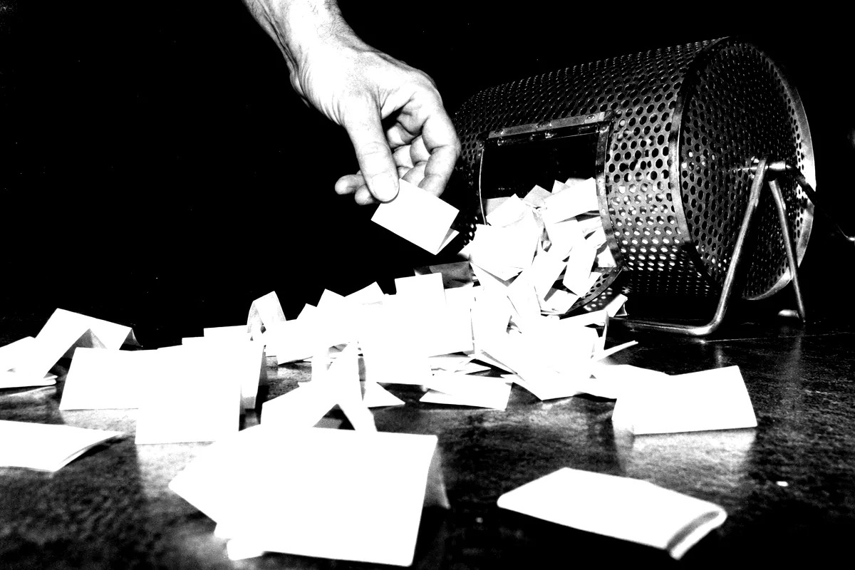 A raffle drum spilling tickets