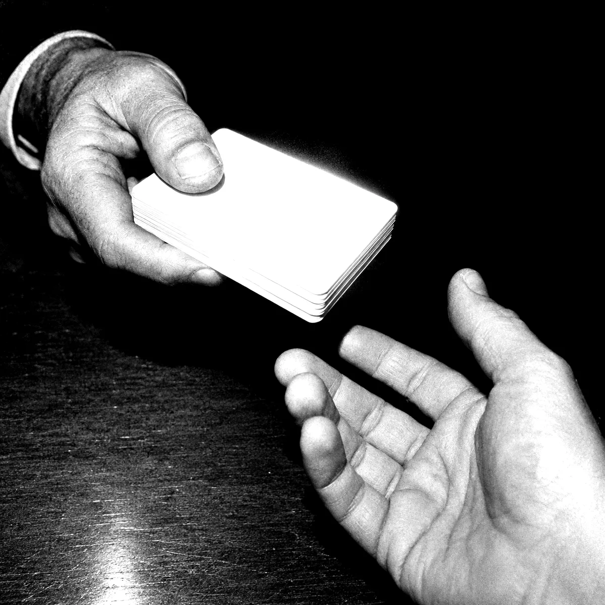 A stack of blank cards handed over